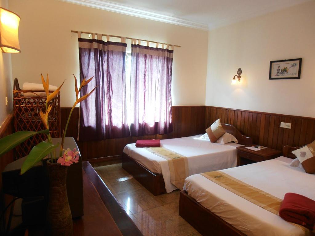 Firefly Guesthouse - The Berlin Angkor Siem Reap Zimmer foto